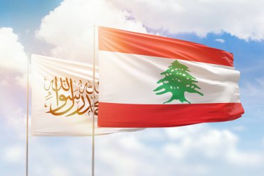 Sunny blue sky and flags of lebanon and afghanistan
