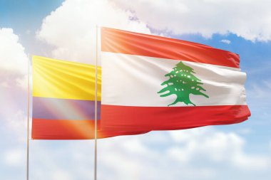 Sunny blue sky and flags of lebanon and colombia