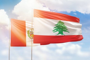 Sunny blue sky and flags of lebanon and peru