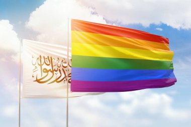 Sunny blue sky and flags of lgbt and afghanistan