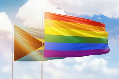 Sunny blue sky and flags of lgbt and bahamas