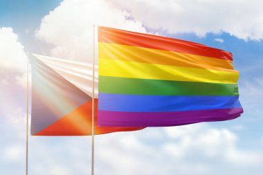 Sunny blue sky and flags of lgbt and czechia
