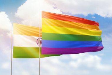 Sunny blue sky and flags of lgbt and india
