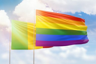Sunny blue sky and flags of lgbt and mali