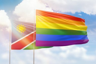 Sunny blue sky and flags of lgbt and namibia