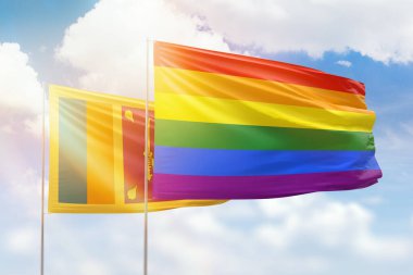 Sunny blue sky and flags of lgbt and sri lanka