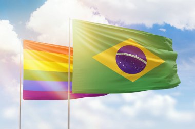 Sunny blue sky and flags of lgbt and brazil