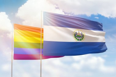 Sunny blue sky and flags of lgbt and el salvador