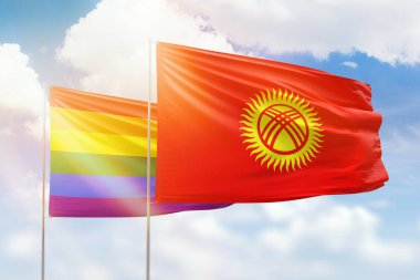 Sunny blue sky and flags of lgbt and kyrgyzstan
