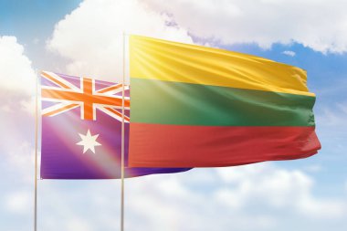 Sunny blue sky and flags of lithuania and australia