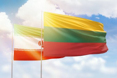Sunny blue sky and flags of lithuania and iran