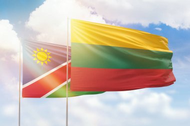 Sunny blue sky and flags of lithuania and namibia