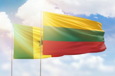 Sunny blue sky and flags of lithuania and senegal