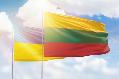 Sunny blue sky and flags of lithuania and ukraine