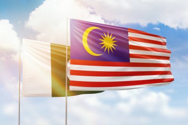 Sunny blue sky and flags of malaysia and pakistan