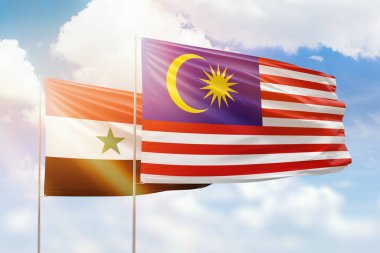 Sunny blue sky and flags of malaysia and syria