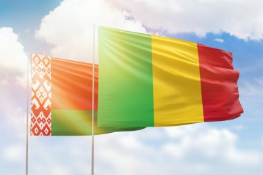 Sunny blue sky and flags of mali and belarus