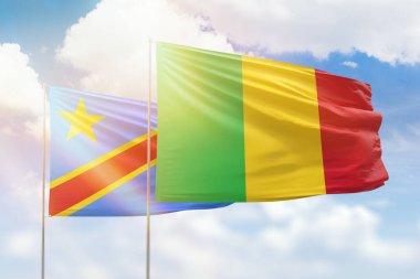 Sunny blue sky and flags of mali and dr congo