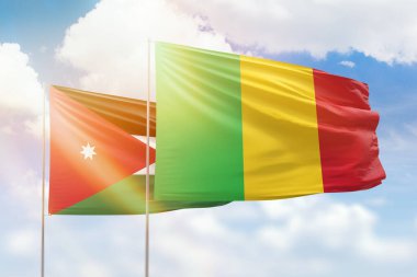 Sunny blue sky and flags of mali and jordan