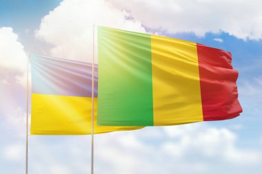 Sunny blue sky and flags of mali and ukraine