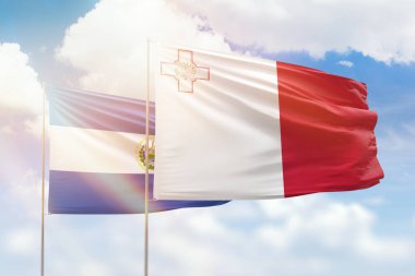 Sunny blue sky and flags of malta and el salvador