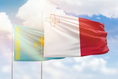 Sunny blue sky and flags of malta and kazakhstan