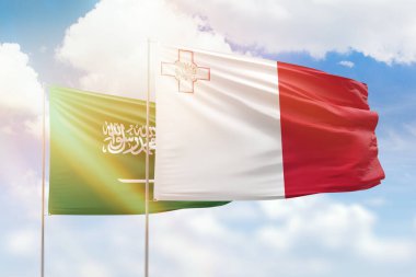 Sunny blue sky and flags of malta and saudi arabia