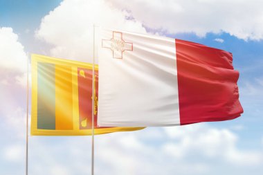 Sunny blue sky and flags of malta and sri lanka