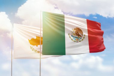 Sunny blue sky and flags of mexico and cyprus