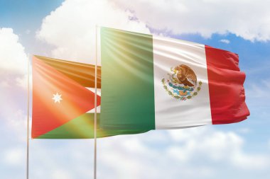 Sunny blue sky and flags of mexico and jordan