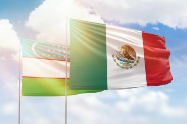 Sunny blue sky and flags of mexico and uzbekistan