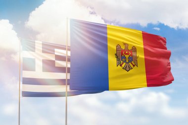 Sunny blue sky and flags of moldova and greece