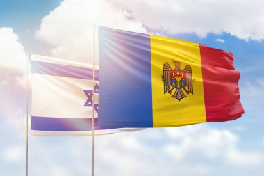 Sunny blue sky and flags of moldova and israel