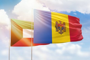 Sunny blue sky and flags of moldova and kuwait
