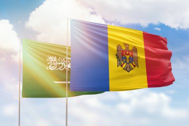 Sunny blue sky and flags of moldova and saudi arabia