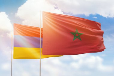 Sunny blue sky and flags of morocco and armenia