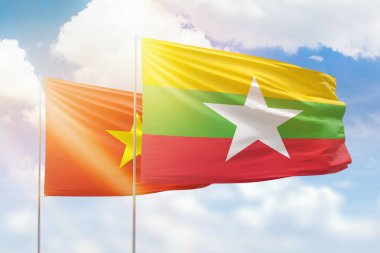 Sunny blue sky and flags of myanmar and vietnam
