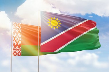 Sunny blue sky and flags of namibia and belarus
