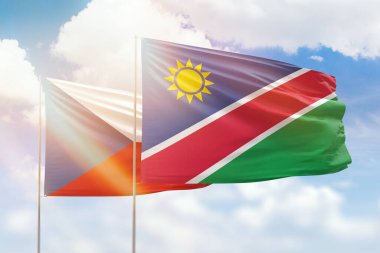 Sunny blue sky and flags of namibia and czechia