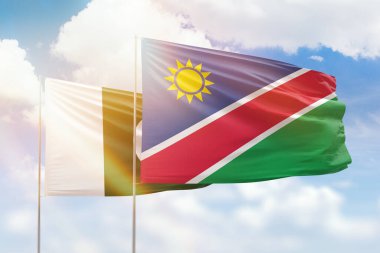 Sunny blue sky and flags of namibia and pakistan
