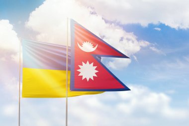 Sunny blue sky and flags of nepal and ukraine