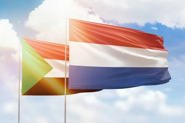 Sunny Blue Sky Flags Netherlands Sudan — 图库照片
