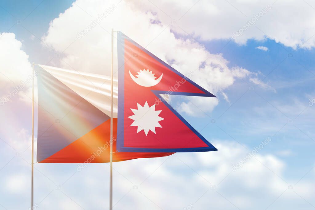 Sunny blue sky and flags of nepal and czechia