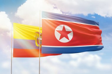 Sunny blue sky and flags of north korea and ecuador