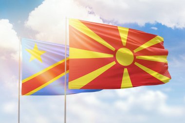 Sunny blue sky and flags of north macedonia and dr congo