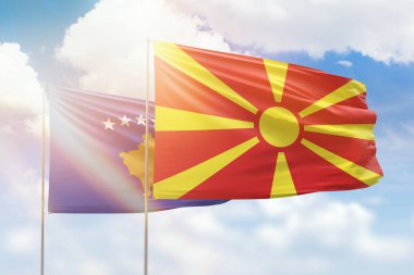 Sunny blue sky and flags of north macedonia and kosovo