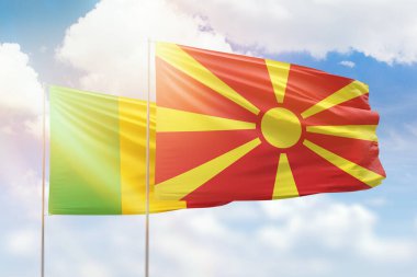 Sunny blue sky and flags of north macedonia and mali