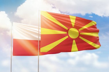 Sunny blue sky and flags of north macedonia and poland