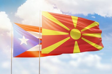 Sunny blue sky and flags of north macedonia and puerto rico