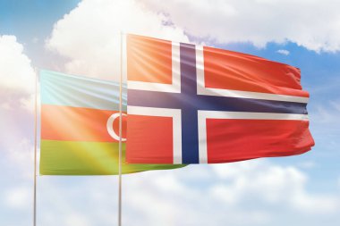 Sunny blue sky and flags of norway and azerbaijan